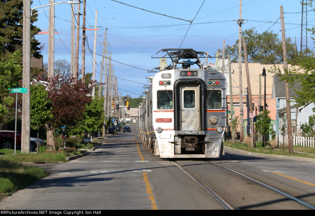 26 brings up the rear as its train pulls down to a stop